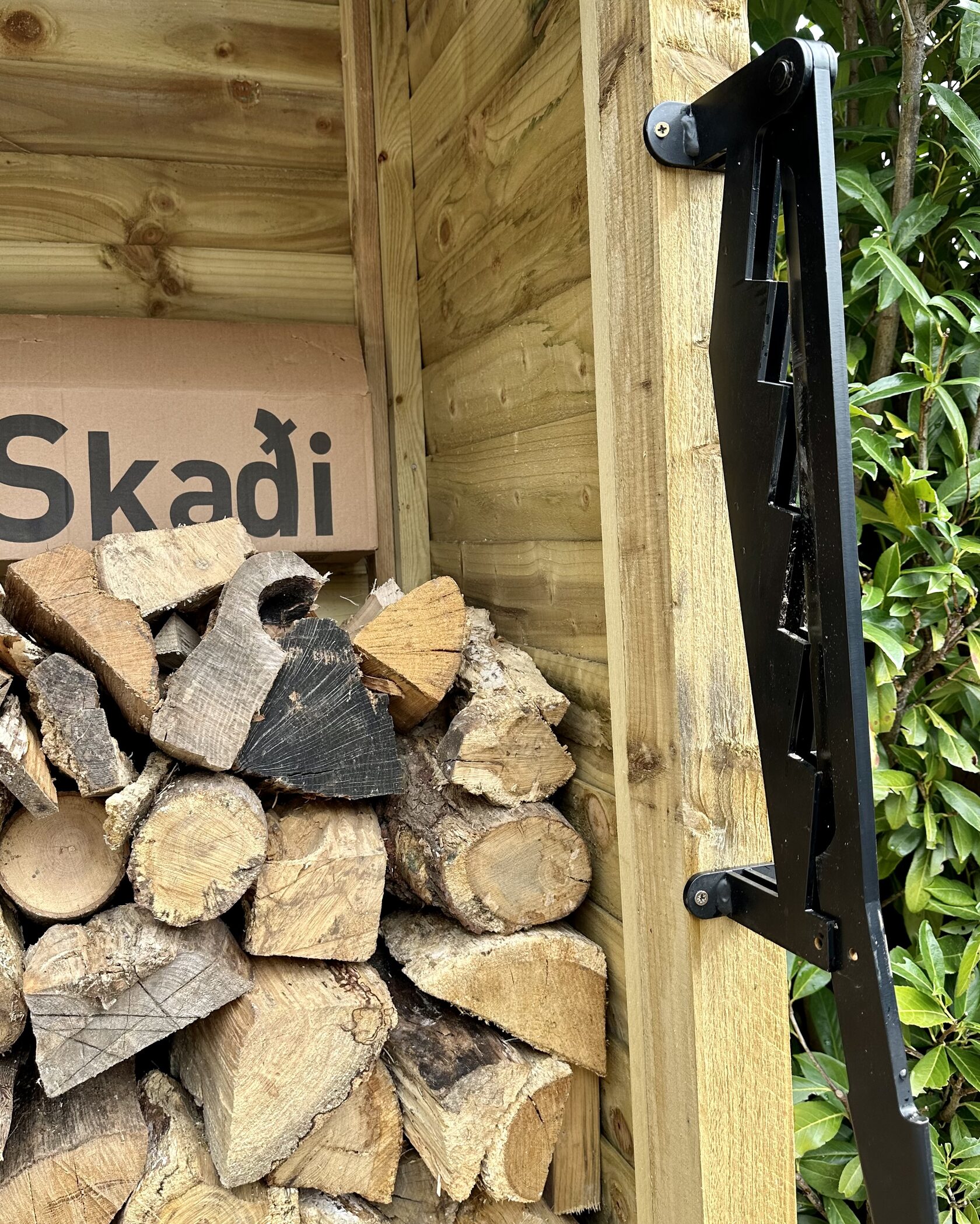 Ready to use — mounted post, box and logs at the ready